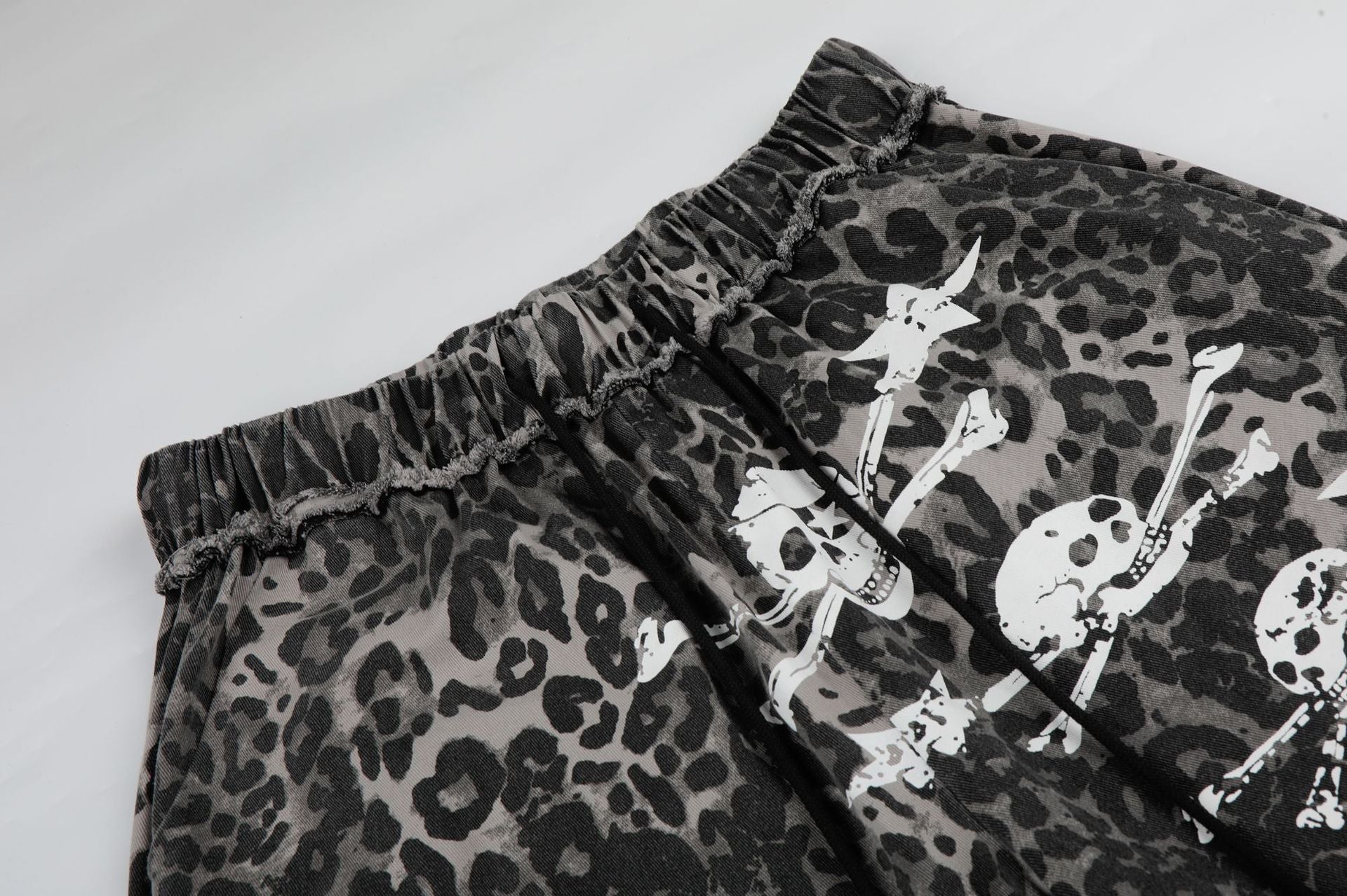 Wide-Leg Leopard Print Pants with Skull & Crossbones Graphic