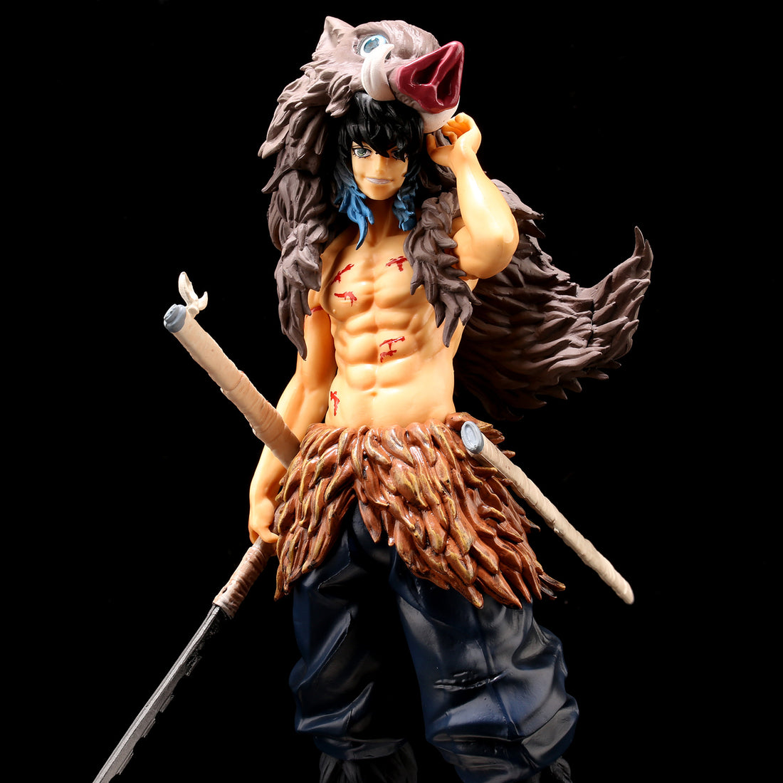 This impressive 29cm Izuki Inosuke Demon Slayer PVC figure features a muscular character with a boar head cap and animal hide clothing, armed with two swords against a plain black backdrop. A high-quality collectible with detailed sculpting for any fan or collector.