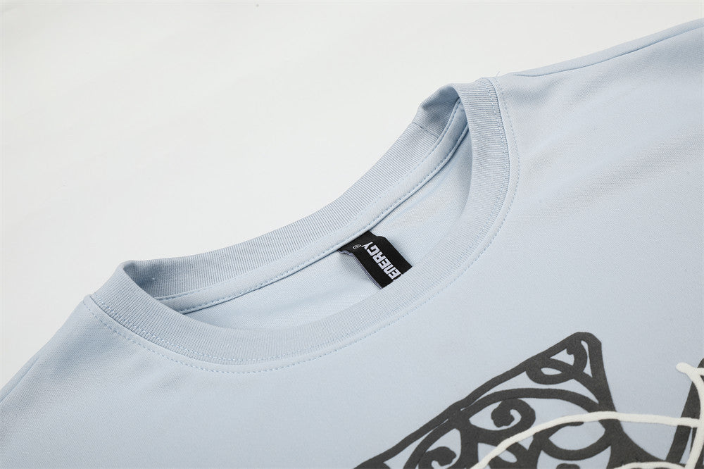 Close-up of light blue crew neck collar and inside neck label