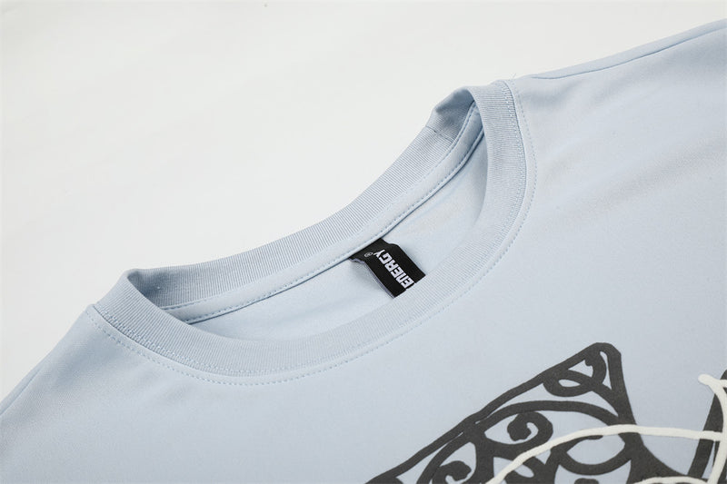 Close-up of light blue crew neck collar and inside neck label