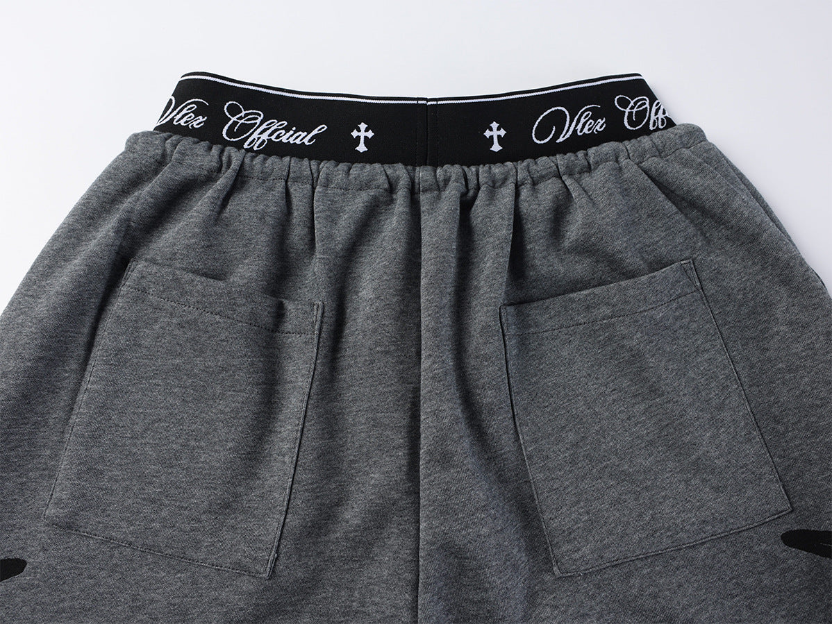 Pantalon de survêtement à jambes larges avec imprimé graffiti cursif et ceinture élastiquée siglée