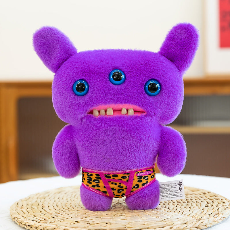 22 cm Purple Three-Eye Monster Plush – Furry Creature Soft Toy with Leopard-Print Shorts