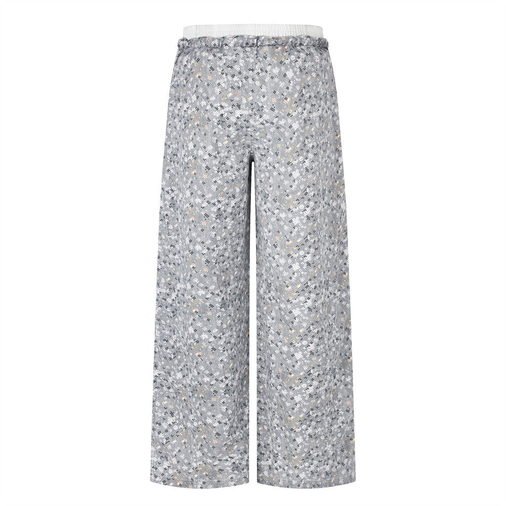 Back view of wide-leg gray floral print pants with elastic waistband