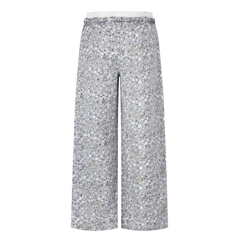 Back view of wide-leg gray floral print pants with elastic waistband