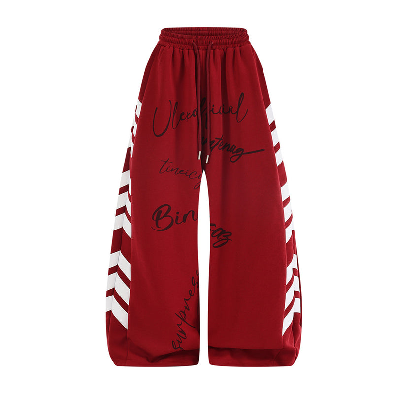 Pantalon de survêtement à jambes larges, rayures diagonales et lettrage – Coupe droite street