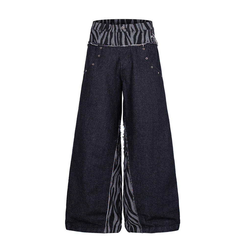 Men's dark indigo wide-leg jeans with zebra-print patchwork side panels and raw-edge double waistband, front and back view