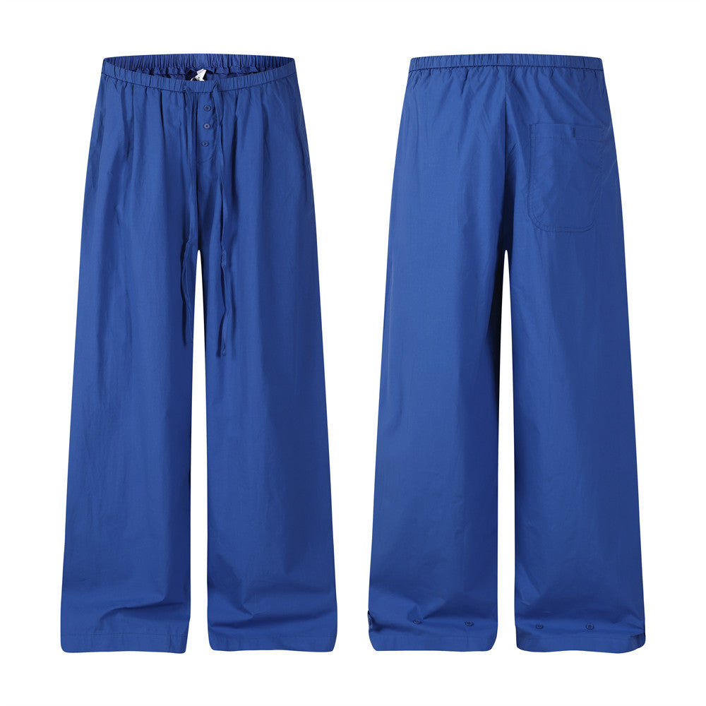 Royal blue wide-leg relaxed fit pants with elastic drawstring waist and button placket, front and back view