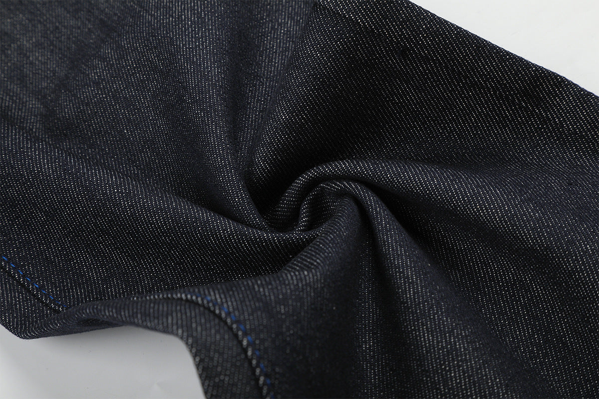 Jean baggy à jambes larges avec broderie bleue effet script et fil barbelé
