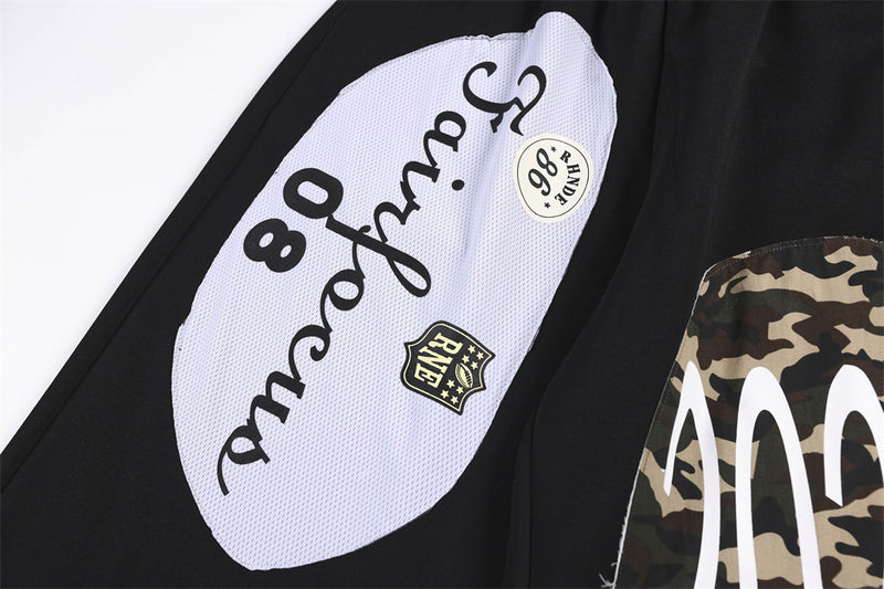 Wide-Leg Sweatpants with Camo & Script Patchwork Appliqués