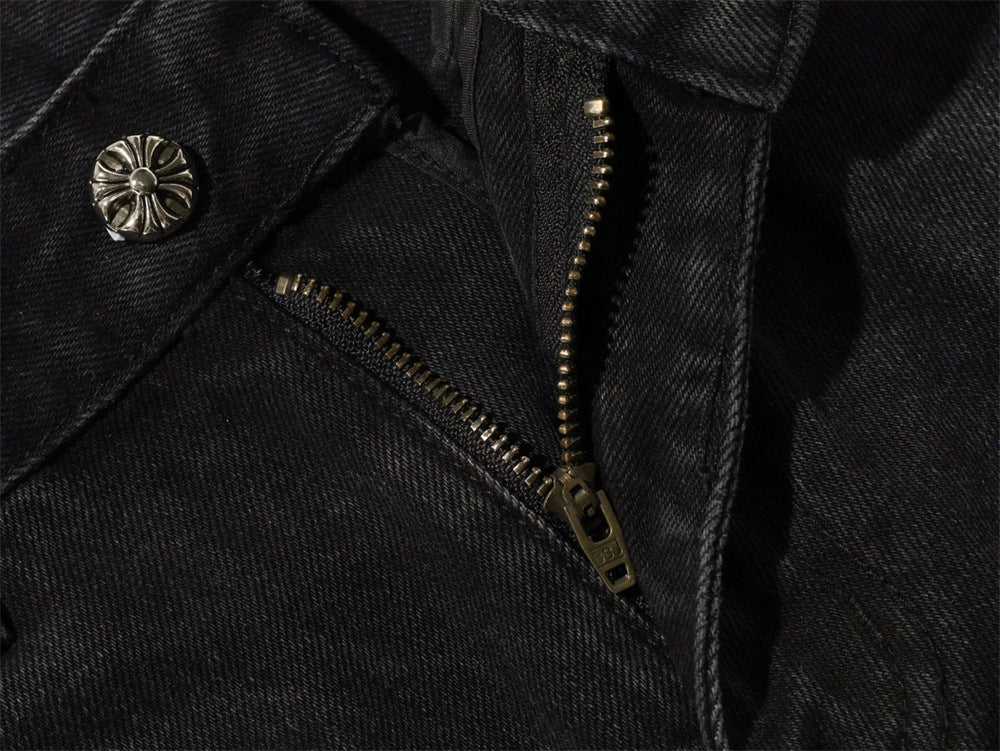 Close-up of black jeans fly zipper and top button
