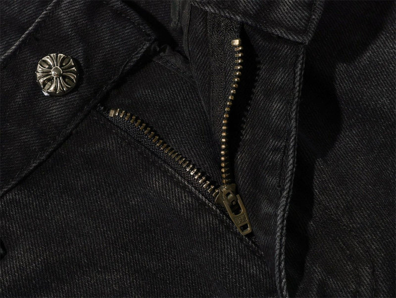 Close-up of black jeans fly zipper and top button