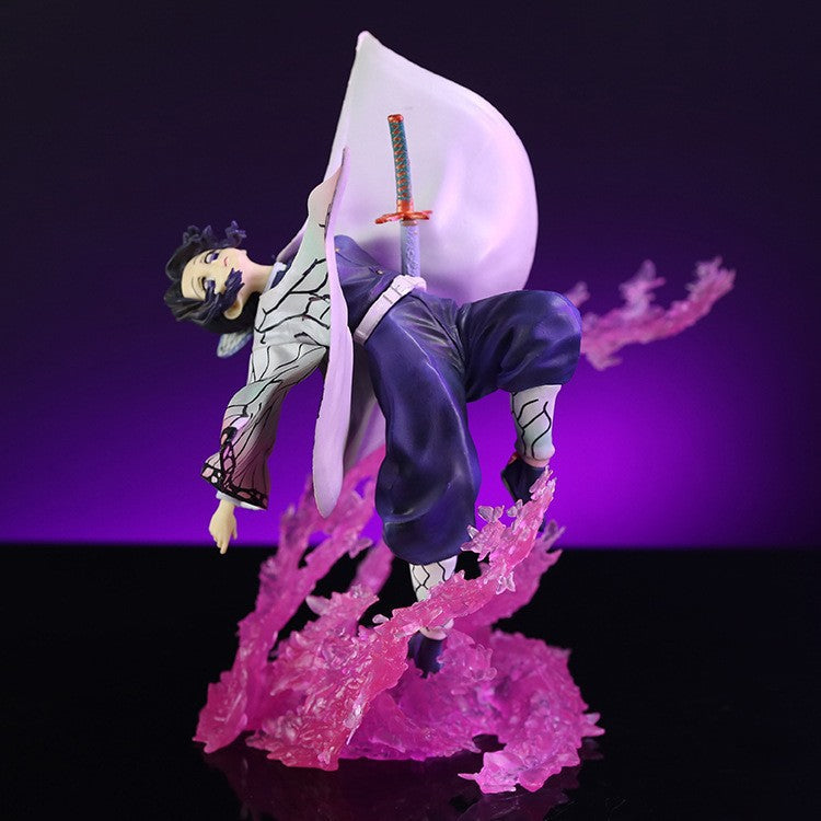 The Demon Slayer Shinobu Kocho Figure is a 20cm high-quality PVC model, showing a Butterfly Ninja with flowing garments and sword, pink translucent energy effects on a purple background. This figure features her black and white outfit and distinct facial expression, weighing 500g.