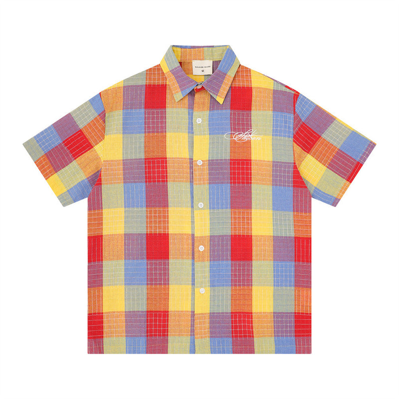 Men's oversized mosaic plaid short sleeve button-up shirt in multicolor patchwork check pattern
