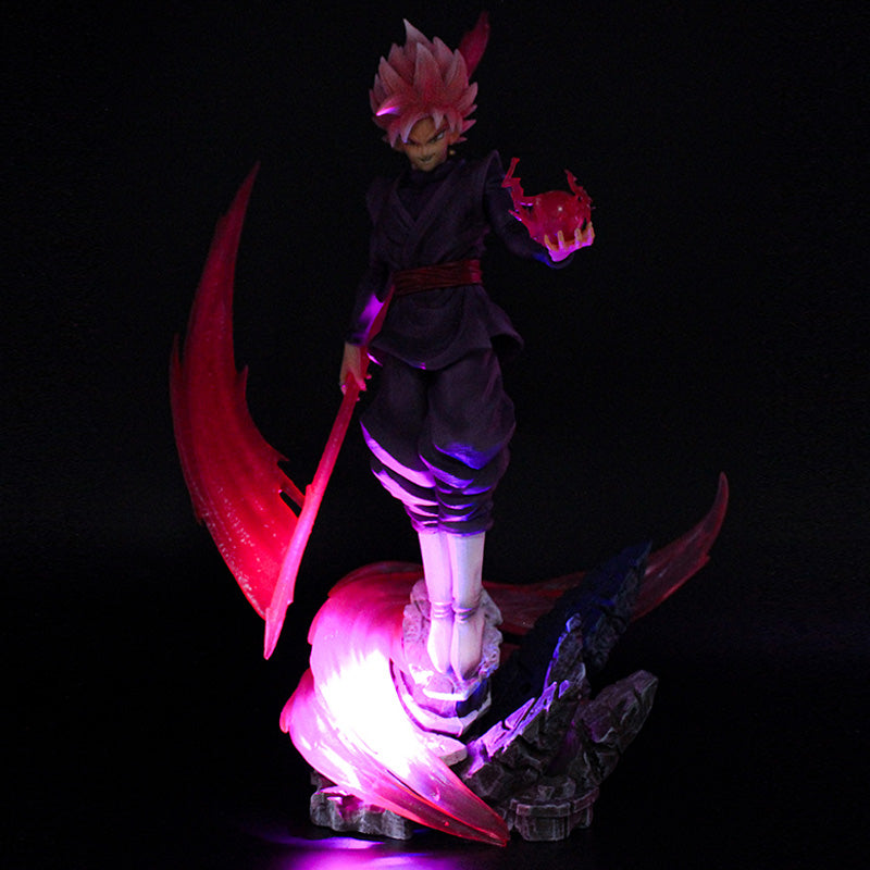 The Seakoff Goku Black Collectible Figure, part of the Dragon Ball Super series, features a dynamic stance with spiky pink hair and a dark outfit. It includes a red energy ball and an illuminated base with purple-red effects to enhance its dramatic flair. The figure stands at 38cm tall.