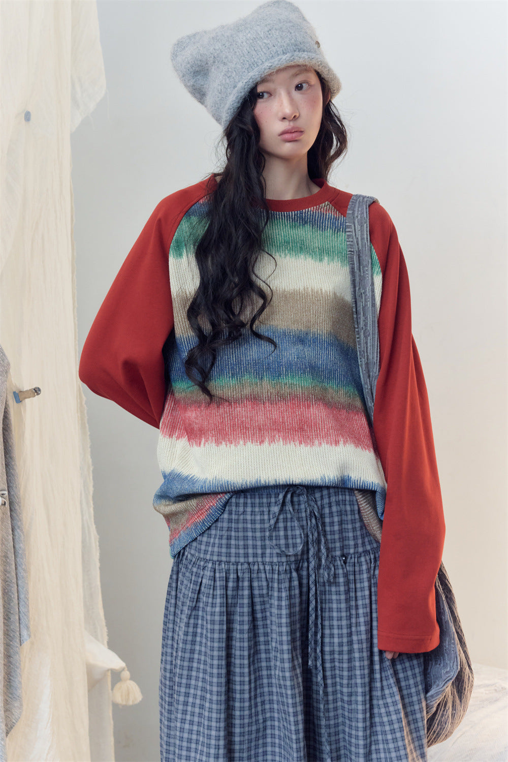 Men's tie-dye stripe raglan long sleeve sweater with rust-red colorblock sleeves and crew neckline
