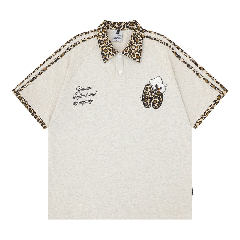 Polo léopard avec broderie ours cartoon et détail cordon porte-carte d’identité