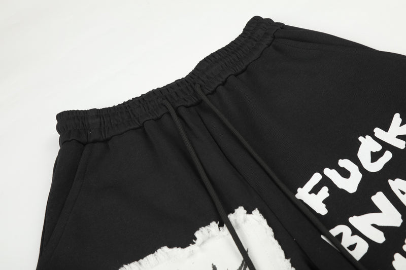 Pantalon de survêtement à jambes larges avec écusson licorne et imprimé graffiti – Streetwear noir