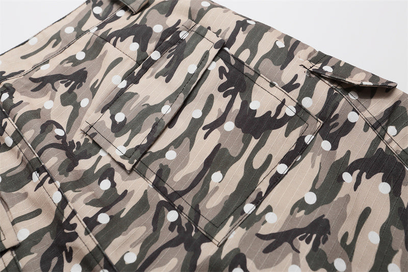 Close-up of back pocket and waistband on camo cargo shorts with flap detail