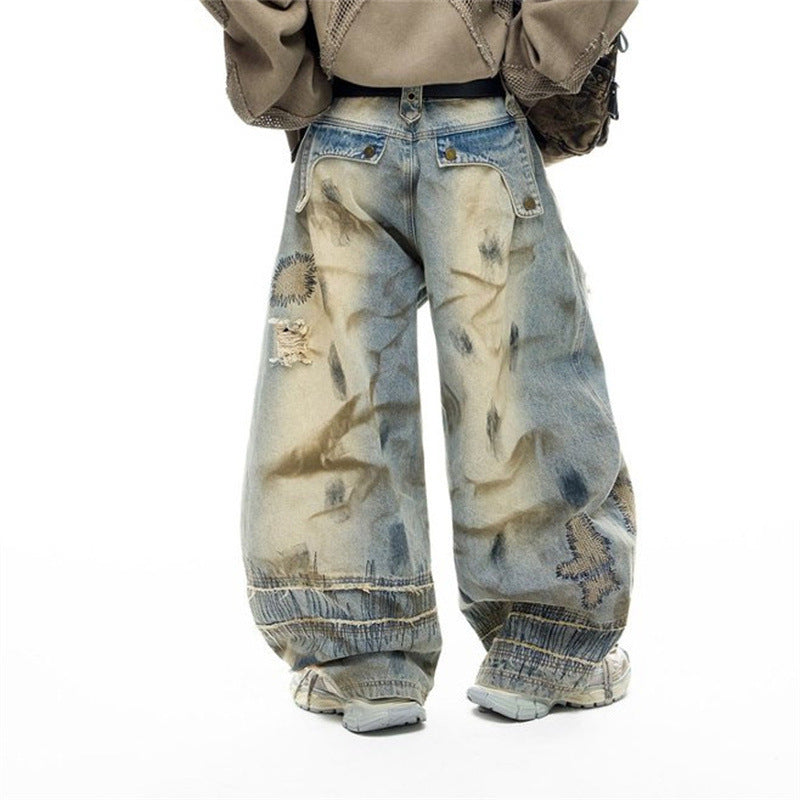Baggy Wide-Leg Jeans – Chaotic Embroidery, Distressed Denim & Arc-Hem Design