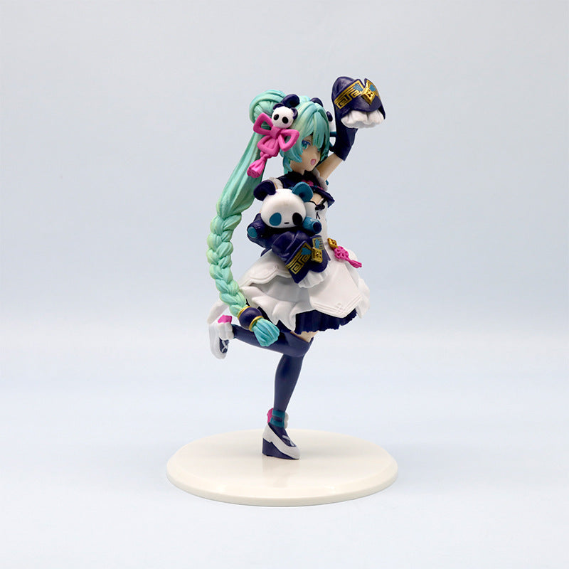 The Hatsune Miku Panda-themed 18cm PVC Figure showcases the green-haired Vocaloid in a blue and white outfit with a side braid, holding panda plush toys and pink bow accessories, all elegantly displayed on a round white base—ideal for any collection.