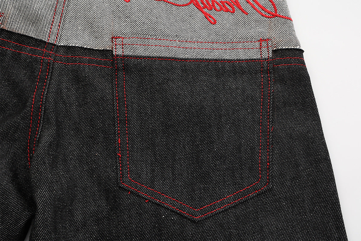 Jean wide leg bicolore à empiècements contrastants et broderie manuscrite – Coupe droite en denim brut