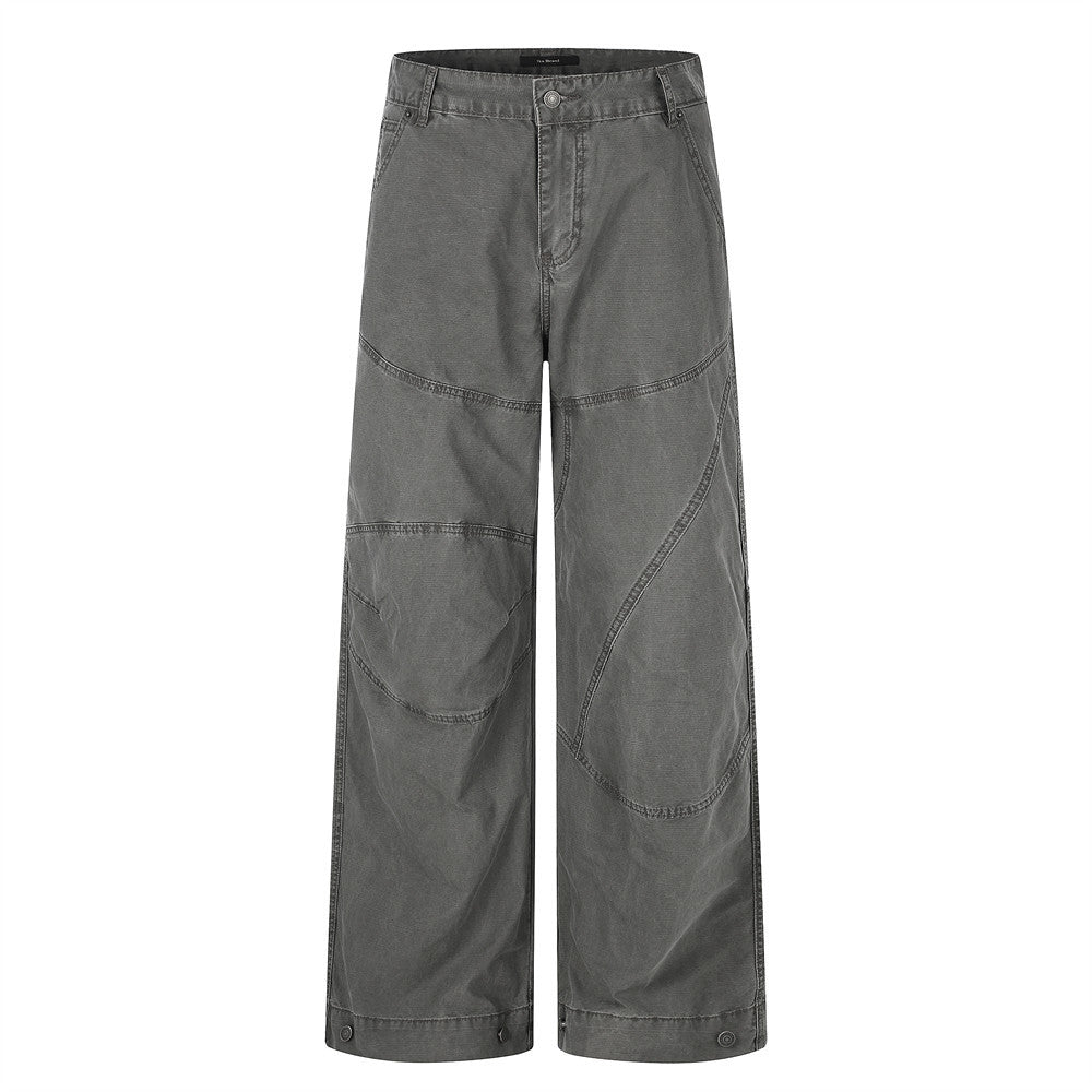Men's wide-leg deconstructed patchwork cargo pants in charcoal grey with curved seam detailing and snap hem buttons