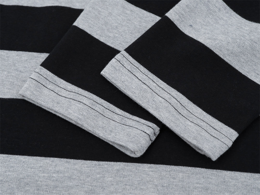 Close-up of folded sleeve cuffs on black and gray striped long sleeve shirt