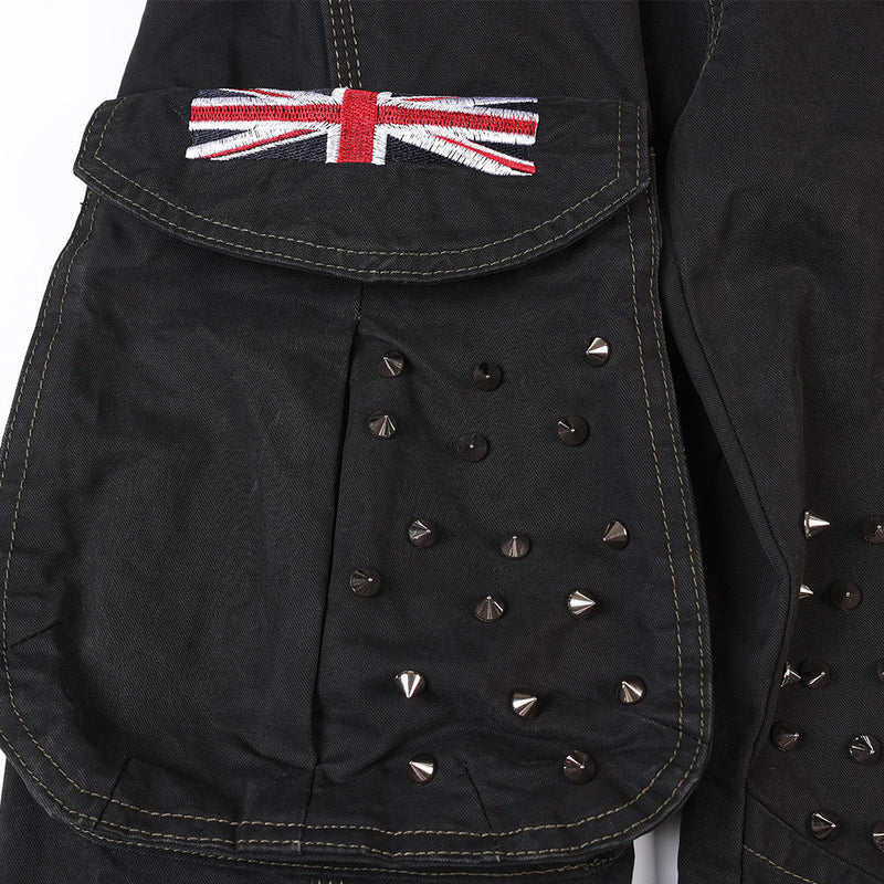 Close-up of cargo pocket flap with Union Jack patch and metal studs on black fabric