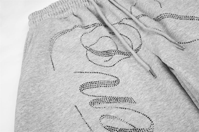 Pantalones de Chándal de Pierna Ancha con Texto de Strass – Corte Bombacho Extragrande con Cordón