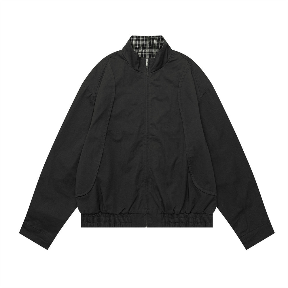 Men's oversized solid black bomber jacket with stand collar and plaid lining detail, front view