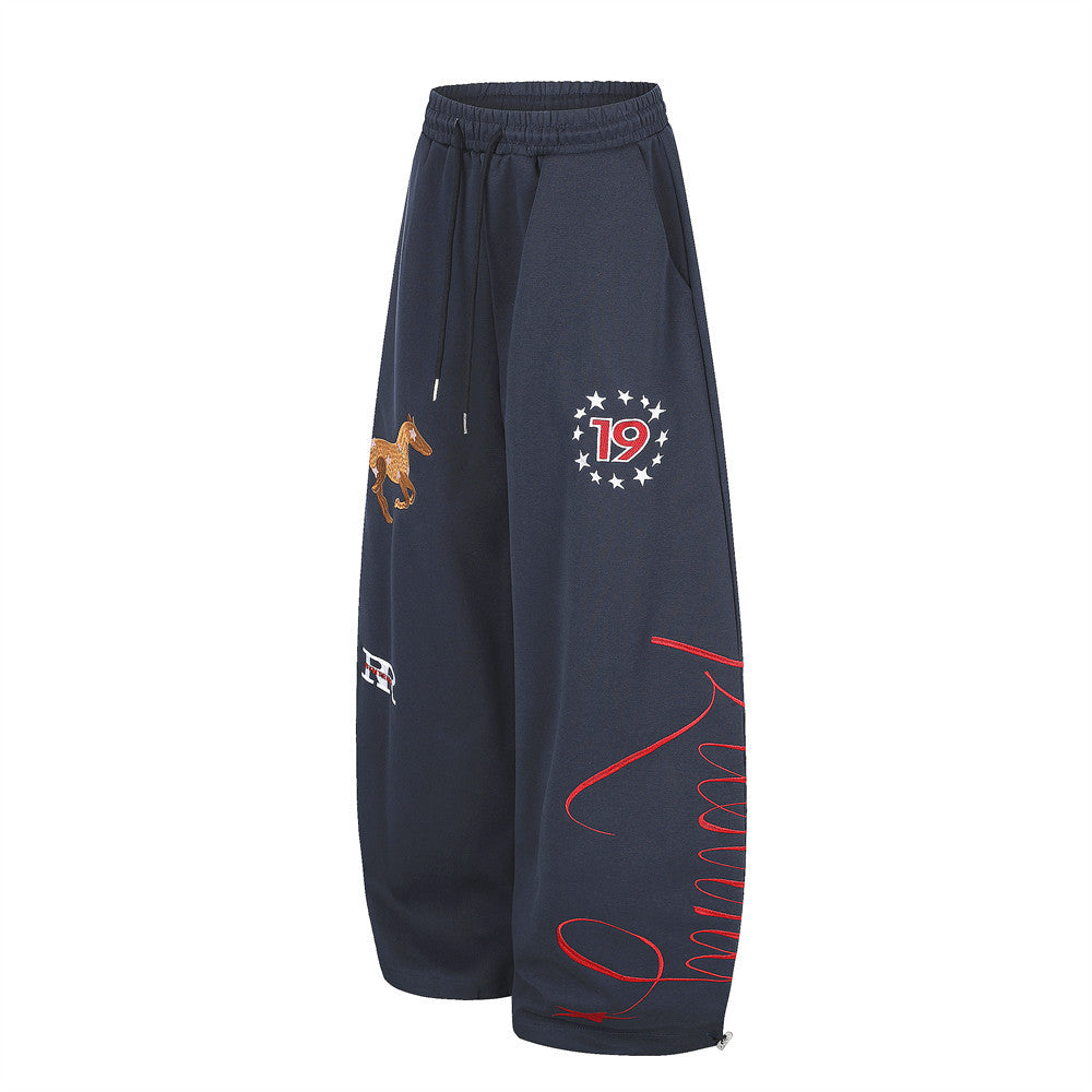 Navy wide-leg sweatpants with horse embroidery, star 19 graphic, and red script print