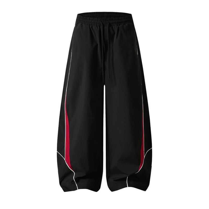 Herren-Trackpants mit kontrastierender Paspel und Colorblock-Seiteneinsätzen