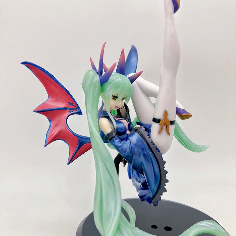 The Hatsune Miku Light &amp; Dark 17cm PVC Figure – Angel and Demon Styles features a character with long green hair, bat-like wings with red interiors and blue exteriors, wearing a blue dress. It strikes a dynamic pose, one leg raised on its circular base.