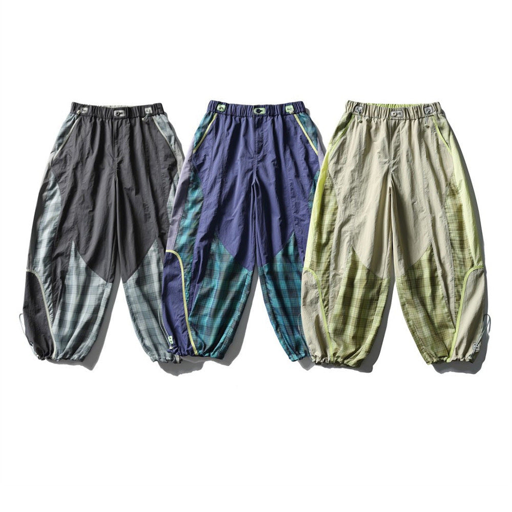 Men's plaid patchwork baggy pants in lava gray, variegated purple, and sand khaki with drawstring ankle cuffs