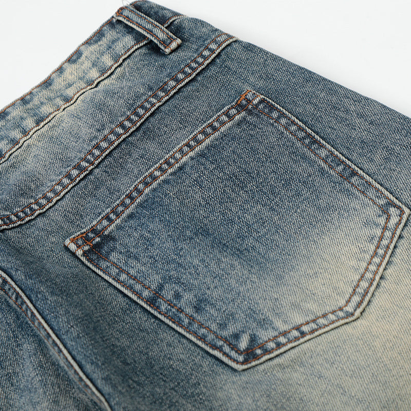 Vintage Washed Wide-Leg Flare Jeans – Distressed Faded Denim with Crease Detail