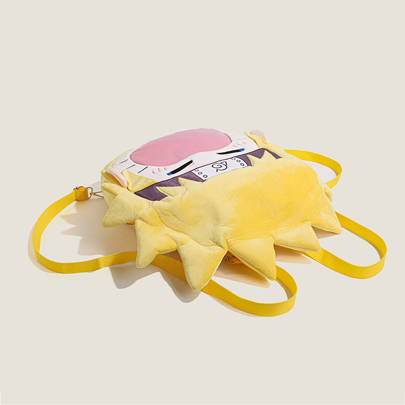 The Seakoff Naruto Uzumaki Plush Shoulder Bag features cartoon designs, a pink face, stitched eyes, and sun ray-like spiky edges. Ideal for fans, its yellow straps ensure easy wear against a light beige background, while a transparent mouth pocket adds charm to this unique accessory.