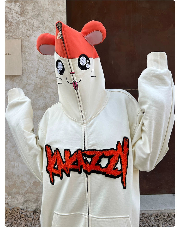 A person is wearing the Seakoff Cute Hamster Cartoon Hoodie, featuring a cartoon animal face and playful ears. It&