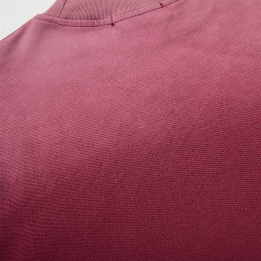 Close-up of solid burgundy back fabric and collar seam