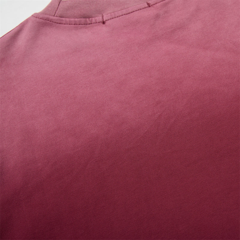 Close-up of solid burgundy back fabric and collar seam