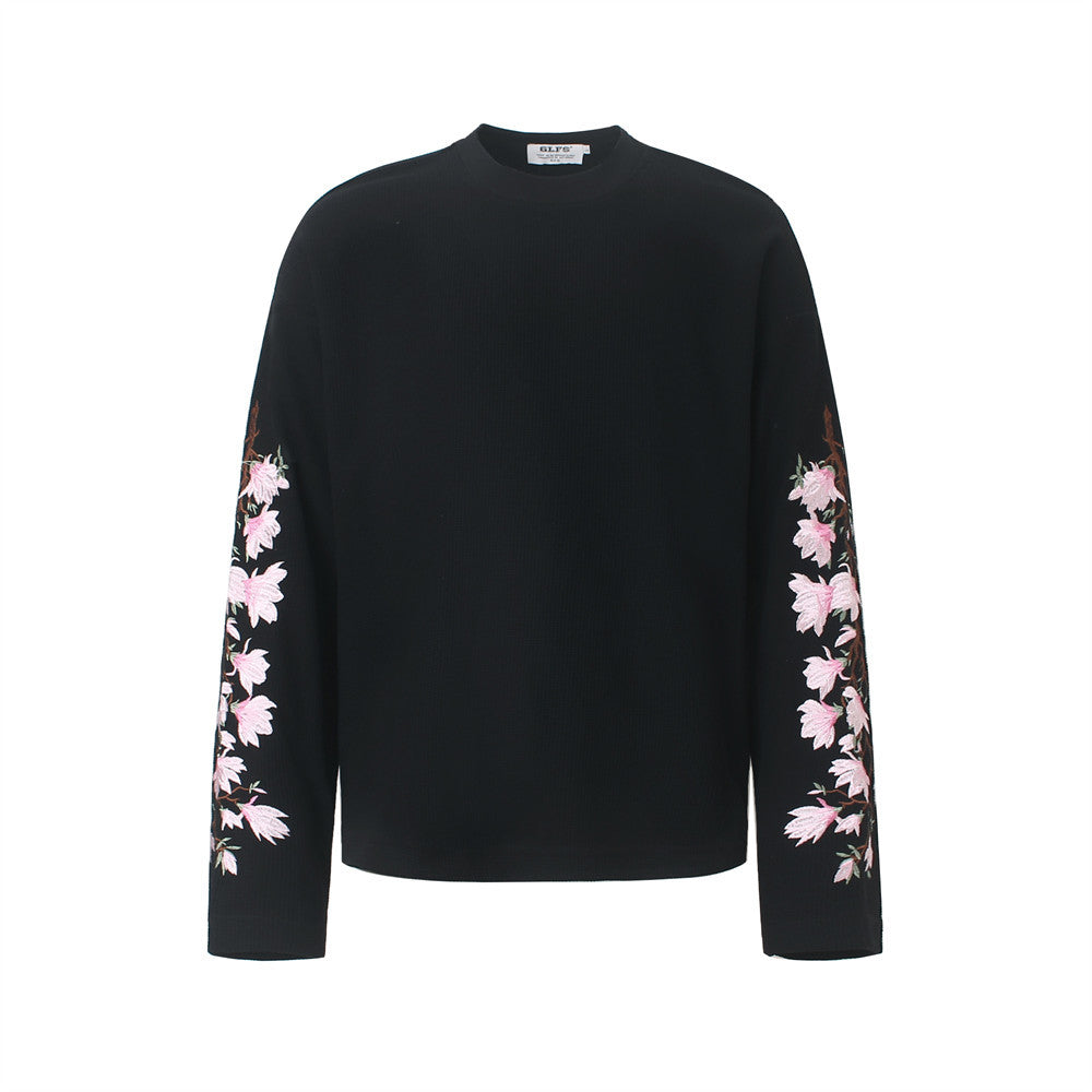 Men's black long-sleeve crew neck t-shirt with pink cherry blossom embroidery on both sleeves