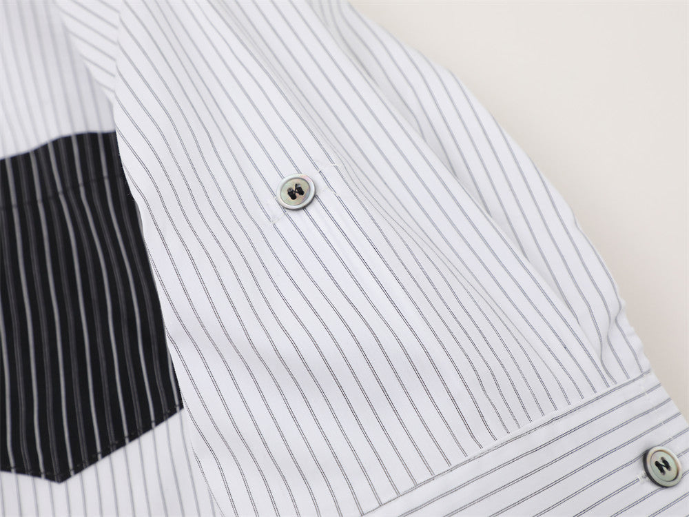 Rolled sleeve detail on white striped short sleeve shirt with snap button