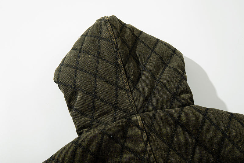 Close-up rear view of the olive green quilted hood without the fur trim visible