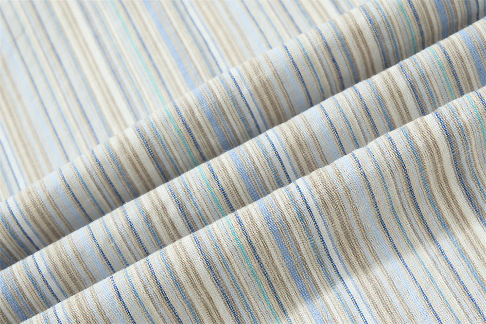 Close-up of folded striped shirt fabric texture