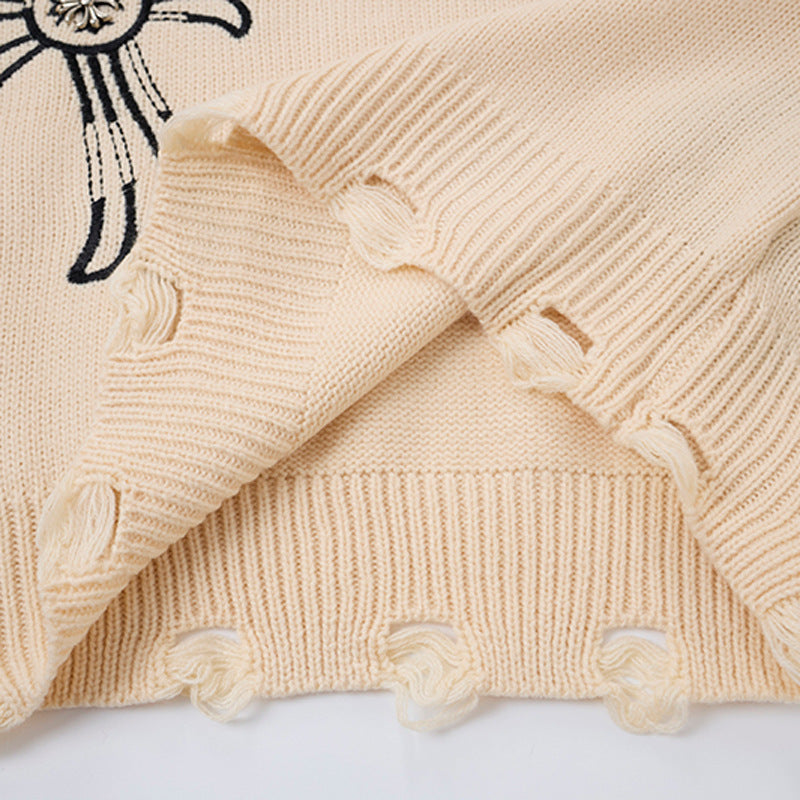 Pull en maille destroy à broderies croisées – Sweat oversize à col rond