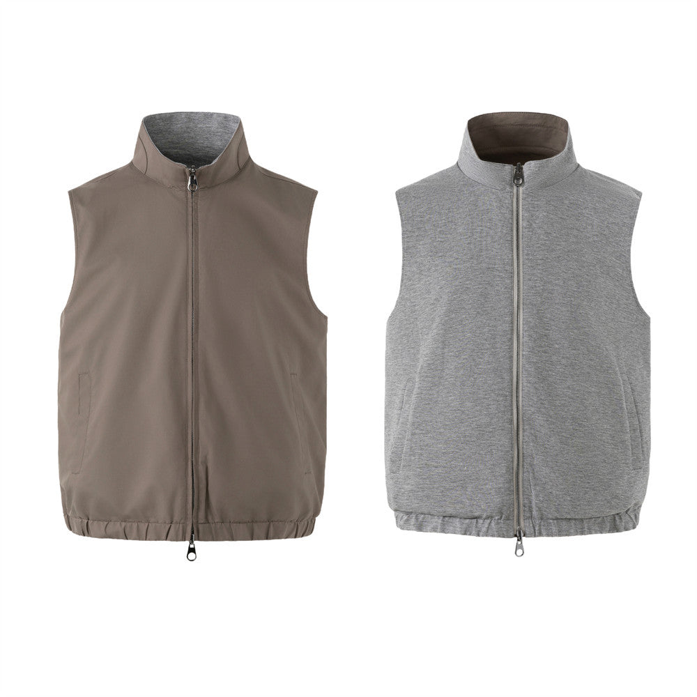 Men's reversible stand-collar sleeveless vest showing taupe shell side and heather grey jersey side with dual-pull zip