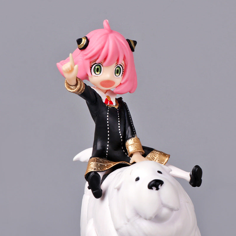 Spy x Family fans will love the Anya Forger PVC Figure, featuring her with pink hair and cat ears, riding a white polar bear. Dressed in black with gold details, she points upward against a gray background. This adorable 17 cm collectible is ideal for enthusiasts of Spy × Family.