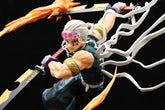 The Seakoff Premium Demon Slayer Urogi Figure stands 37cm tall, showcasing silver hair, red eyes, and two flaming swords. Dressed in a dark sleeveless outfit with forehead goggles and white ribbons against a black background, it features USB light-up effects for dramatic impact.