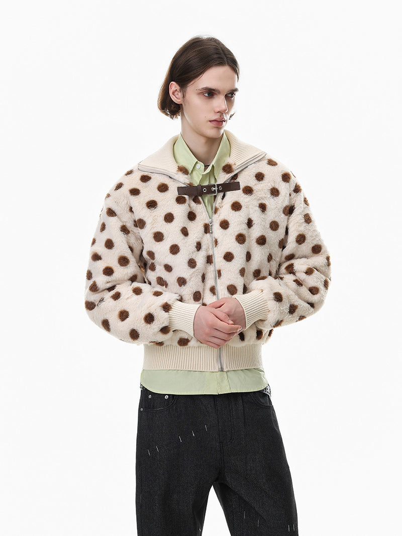 Front view of a cream and brown polka dot faux shearling bomber jacket worn by a model