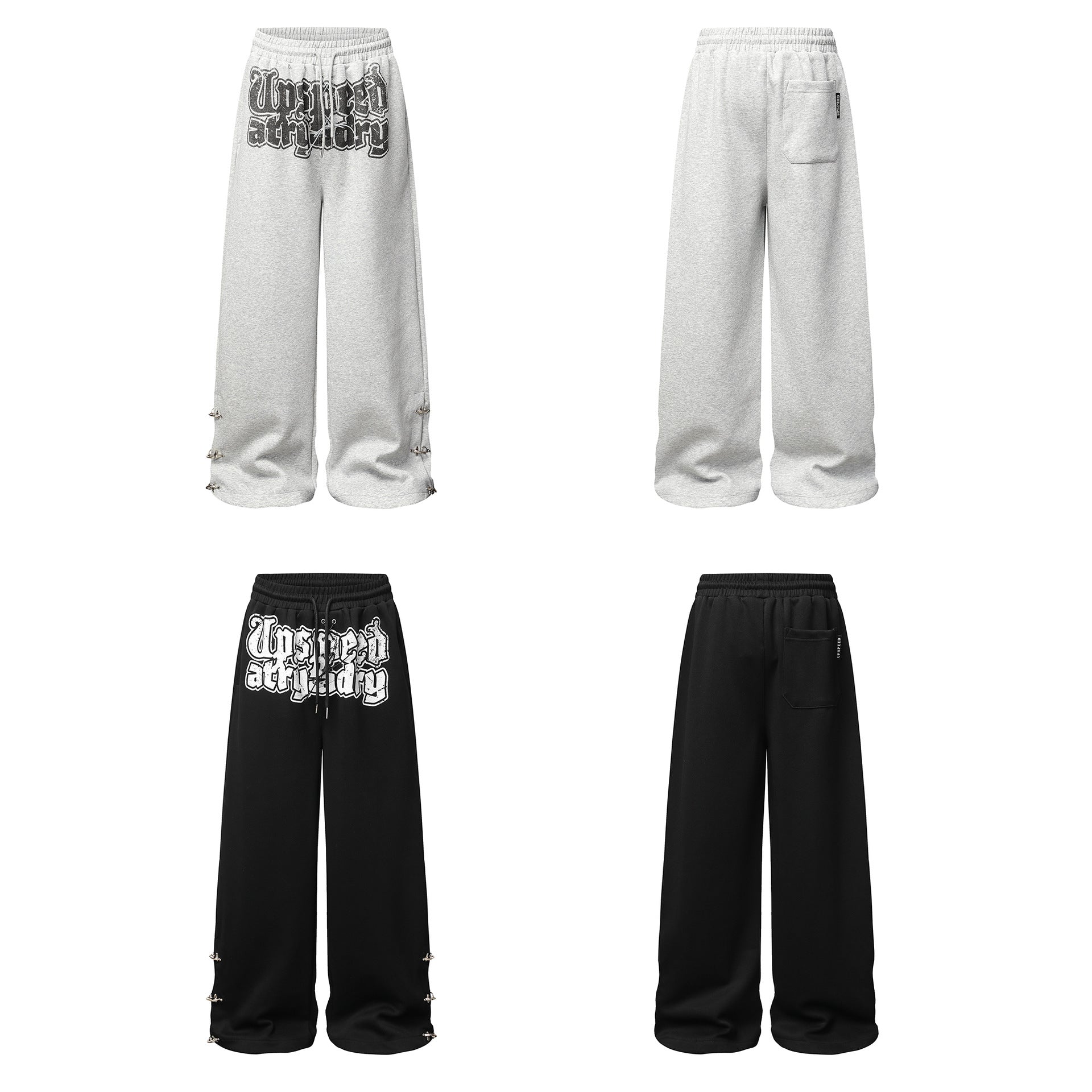 Pantalon de survêtement à jambes larges avec graphisme graffiti et ourlet orné de détails métalliques