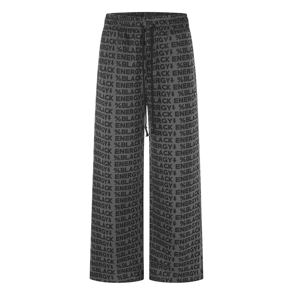 Black wide-leg sweatpants with allover BLACK ENERGY print, front view